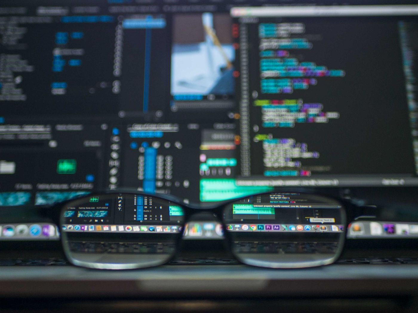 Glasses in front of a monitor full of code, a reminder to check Python output rather than trust it