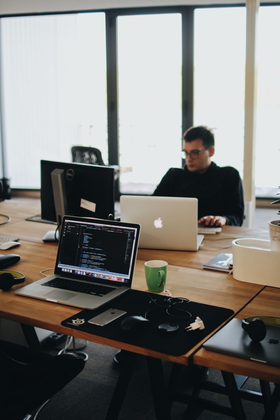 Career change into data engineering at 30, 35, 40 UK — professional writing code on a laptop